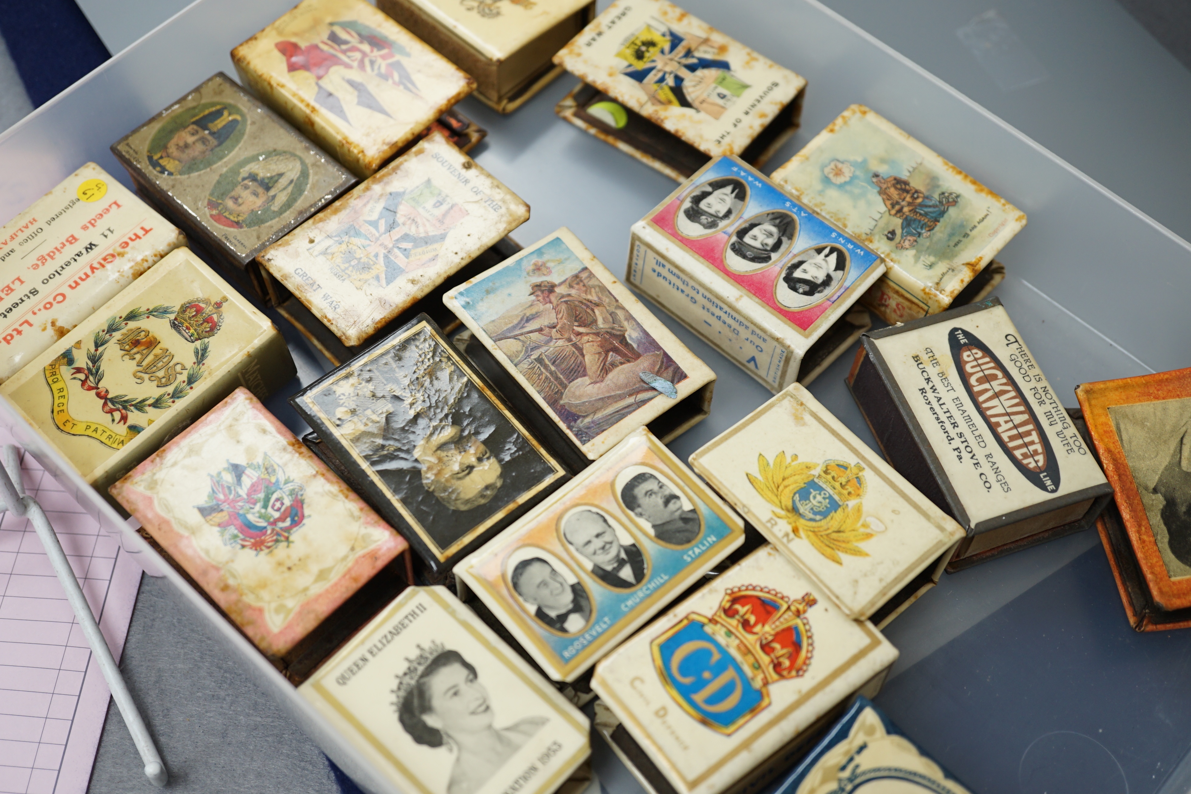 A collection of early and mid 20th century WWII match box holders